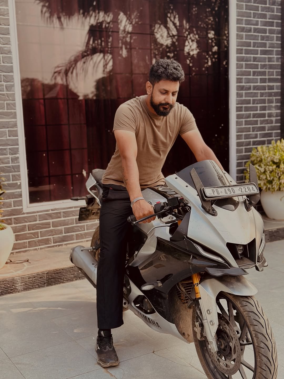 Photo by RD Dhaliwal in ਖਮਾਣੋਂ. May be an image of 1 person, beard, motorcycle, helmet, scooter, road and text.