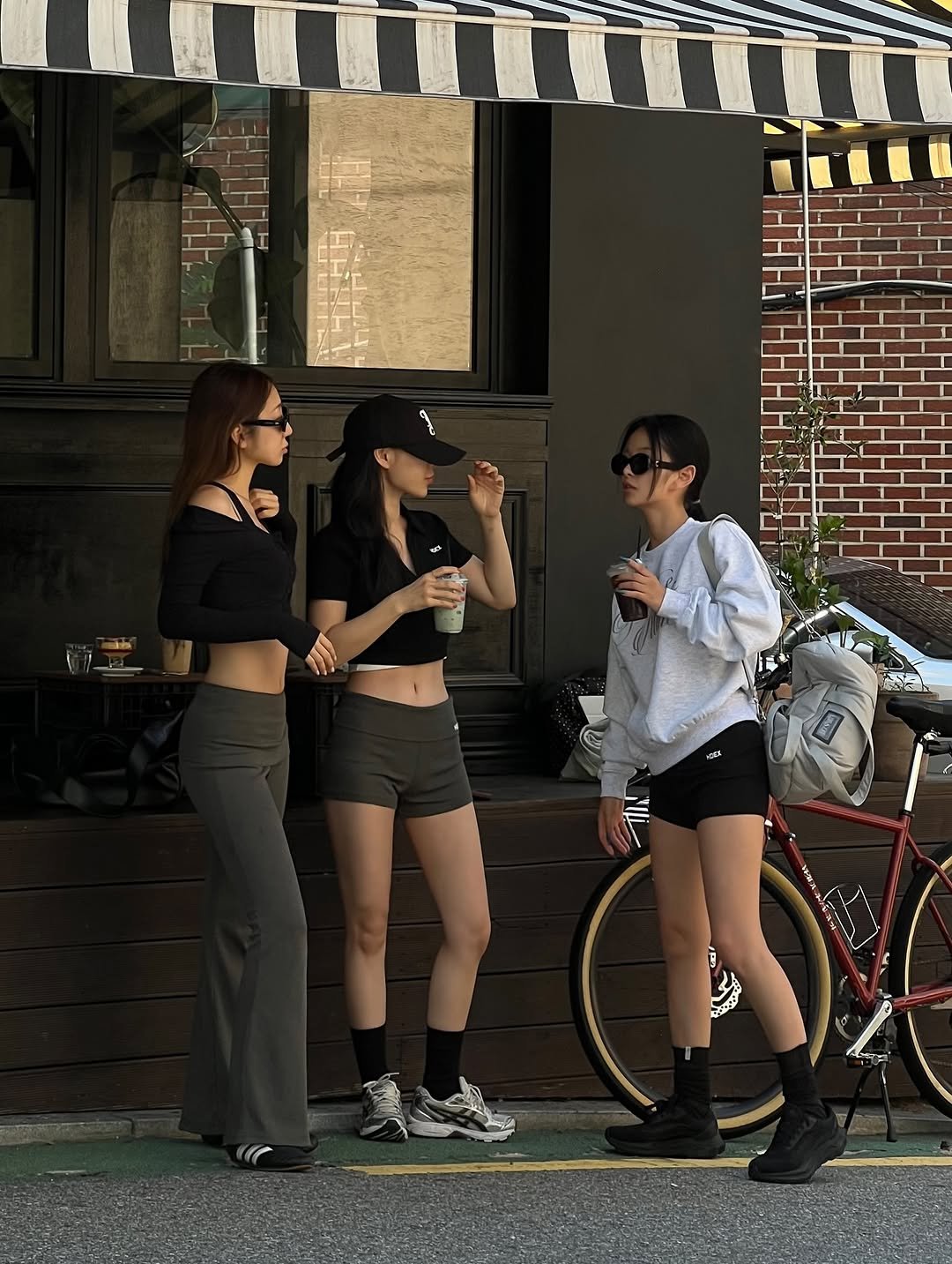 Photo shared by mini note on September 04, 2025 tagging @_lovesoon, @ialwayscreate, and @recovery_coffee_bar. May be an image of 3 people, miniskirt, street and text.