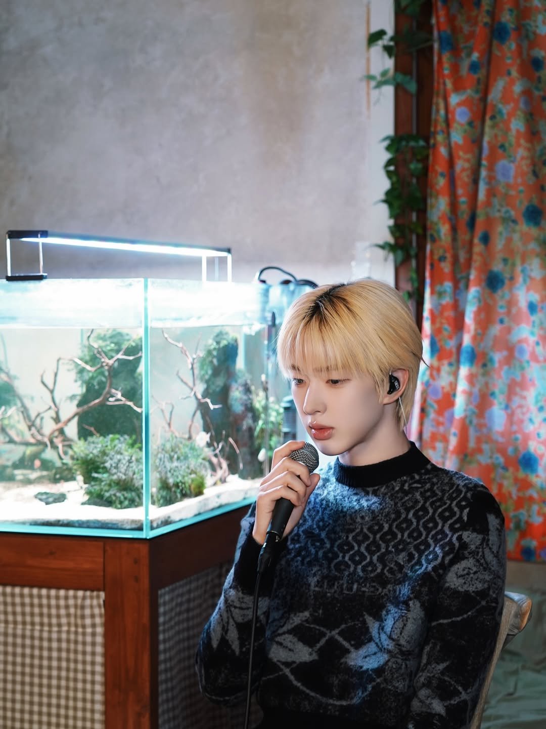 Photo by NEXZ on March 30, 2026. May be an image of one or more people, hair, fish, bolo tie, top and text.