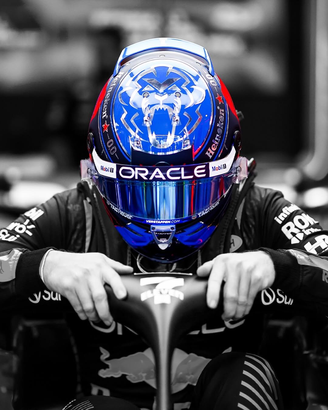 Photo shared by Oracle Red Bull Racing on April 28, 2026 tagging @maxverstappen1. May be an image of racing vehicles, helmet, glasses and text.