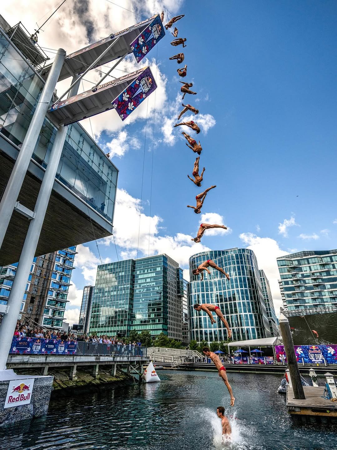 Photo shared by Red Bull USA 🇺🇸 on September 20, 2025 tagging @redbullcliffdiving, and @garydiver. May be an image of 1 person, blimp, jet ski, helicopter and text.