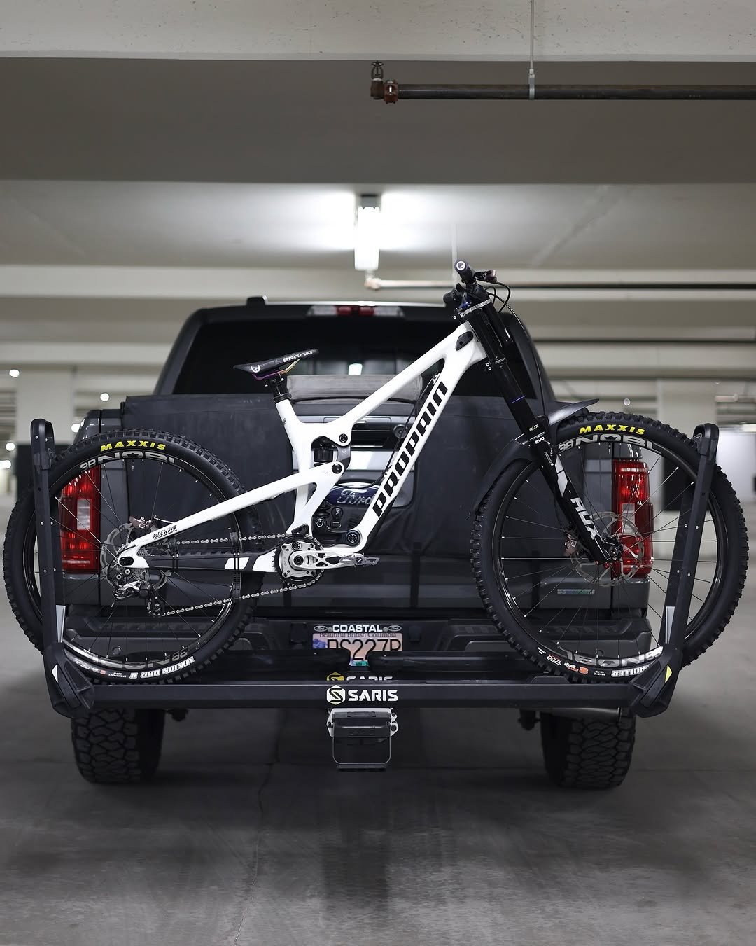 Photo shared by Rémy Métailler on September 19, 2025 tagging @propain_bicycles, @sarisofficial, and @ridewrap. May be an image of bicycle, rack and text.