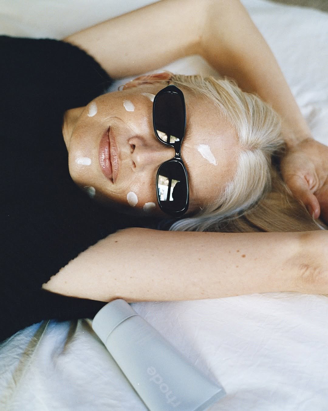 Photo shared by rhode skin on January 16, 2026 tagging @sweetpeasy. May be an image of one or more people, makeup, sunglasses, magazine and text.