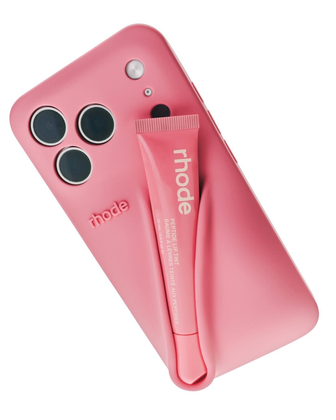 Photo by rhode skin on March 03, 2026. May be an image of one or more people, lipstick, makeup, cosmetics, brush, hand cream and text that says 'mhode rhode 10mL/03fcze LIP BAUME PALME PEPTIDE LEVRES VRES o TINT TEINTÉ AUX PEPTIDES'.