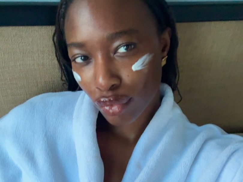 Photo shared by rhode skin on January 15, 2026 tagging @aishatam. May be an image of one or more people, makeup, robe, bath robe, ointment, lotion, hand cream and text.