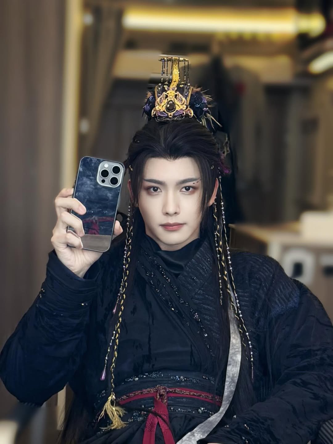 Photo by 王以綸 Riley King on November 21, 2025. May be an image of one or more people, makeup, phone, headdress, costume and text.