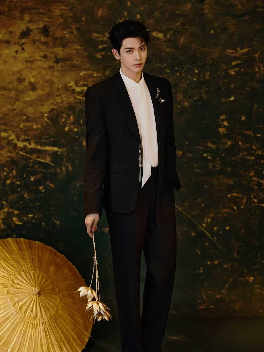 Photo by 王以綸 Riley King on April 27, 2026. May be an image of suit, umbrella, dinner jacket, bolo tie and text.