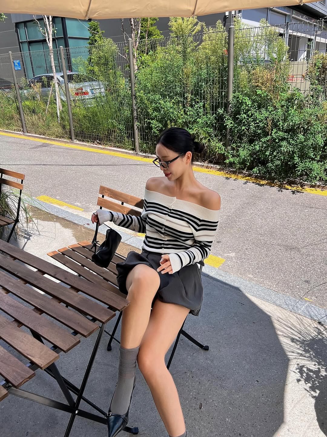 Photo by 리미네 on August 19, 2025. May be an image of 1 person, shorts, miniskirt, cornflower and text.