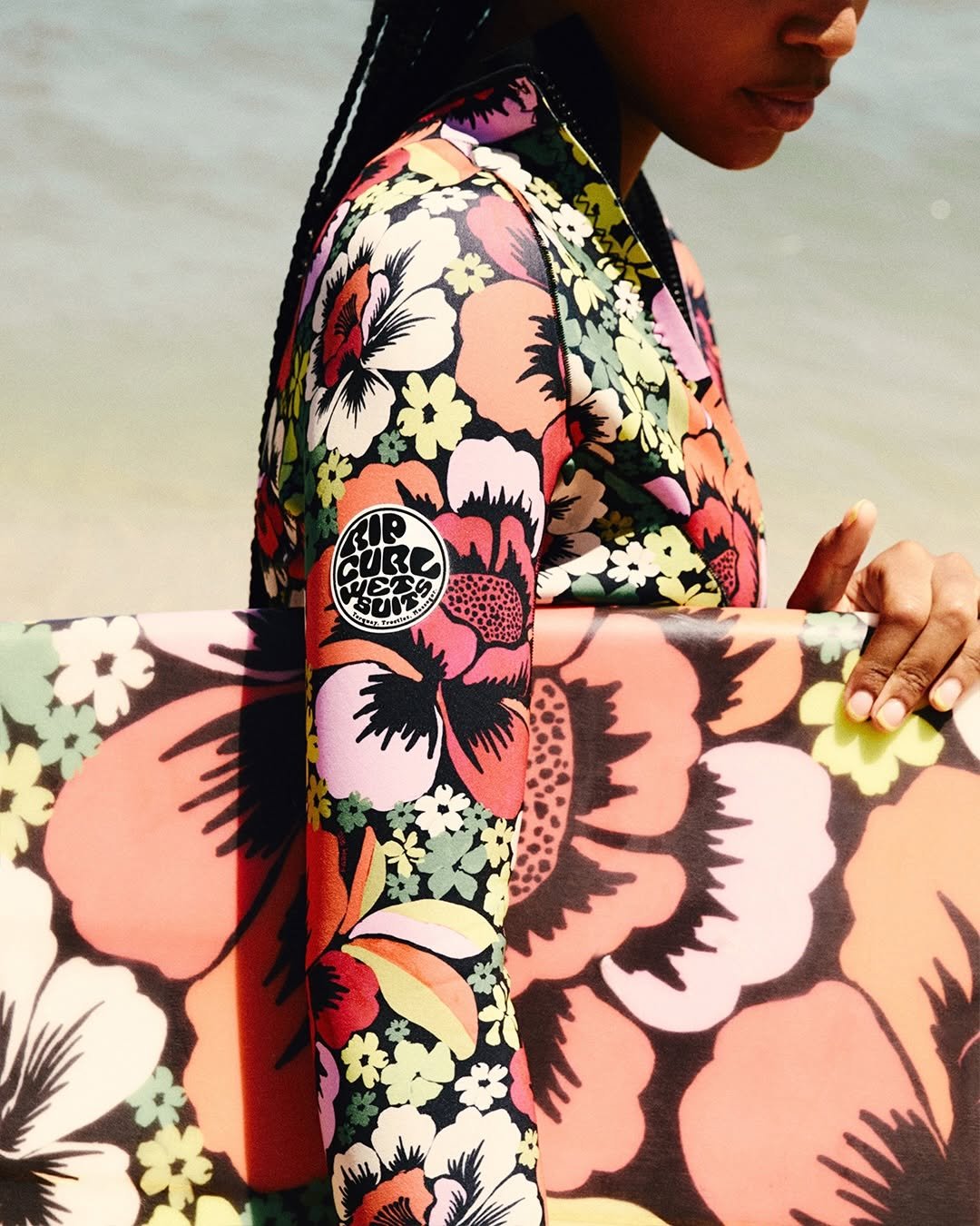 Photo shared by FARM Rio on December 06, 2025 tagging @ripcurl, @ripcurl_brasil, @ripcurl_women, and @farmetc. May be an image of wetsuit, sarong, sling and text.