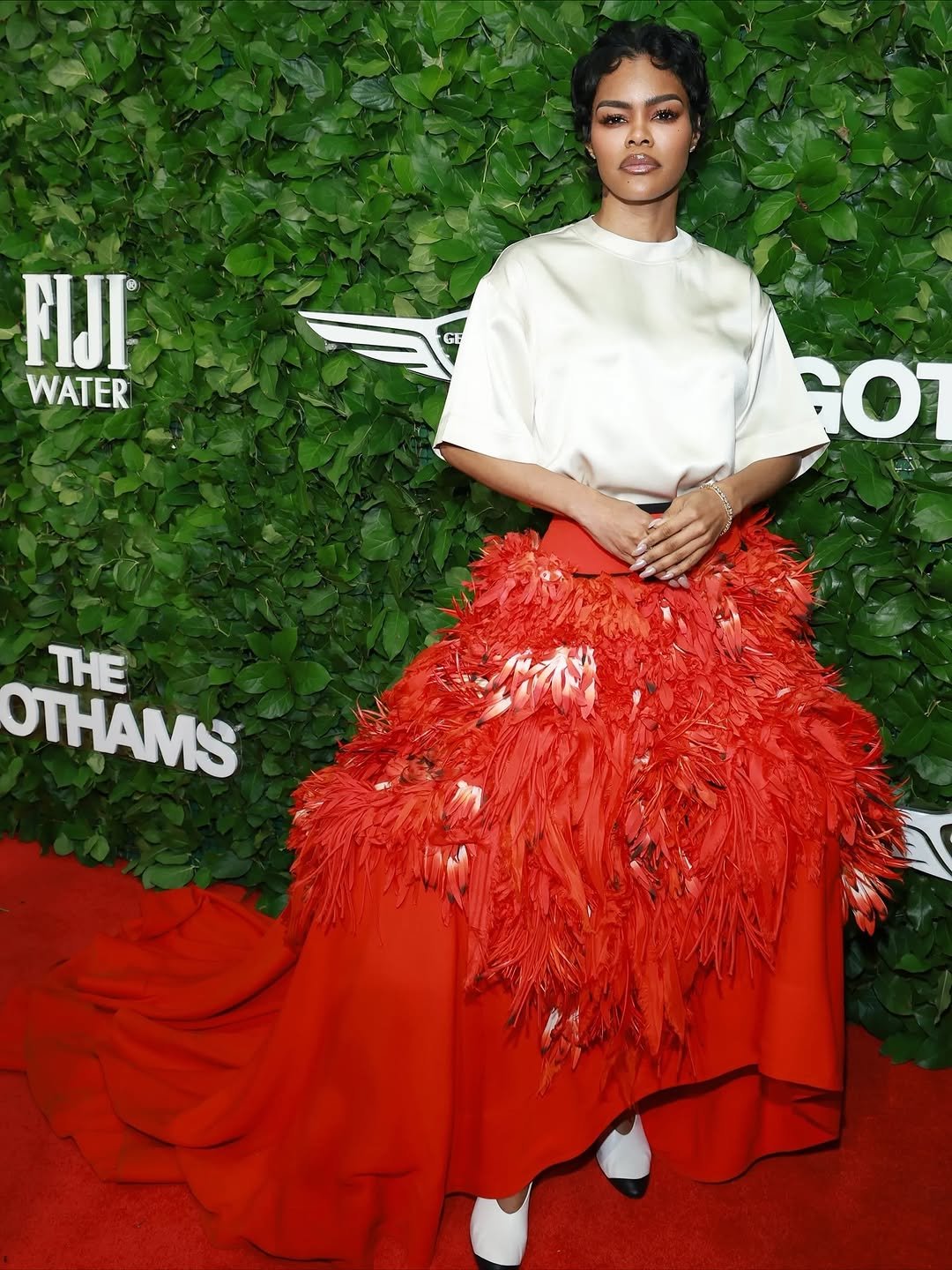 Photo shared by riposò official on December 09, 2025 tagging @teyanataylor, @thegotham, @chanelofficial, and @speakeasynails_. May be an image of one or more people, makeup, gown, carpet, dress and text that says '天 FIJI WATER GE GOT THE THAMS'.