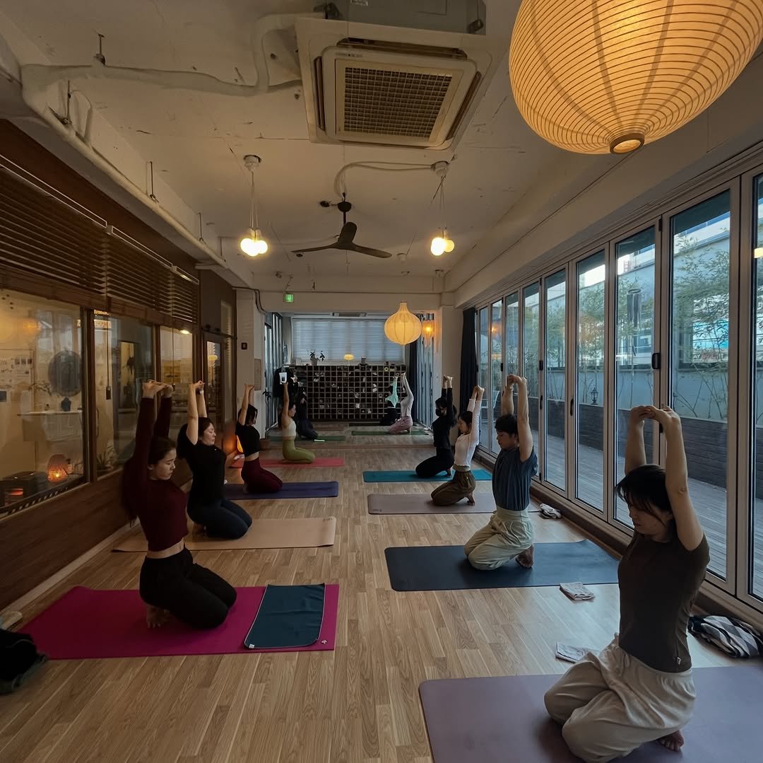 Photo by 려경 요가 on January 01, 2026. May be an image of yoga and text.