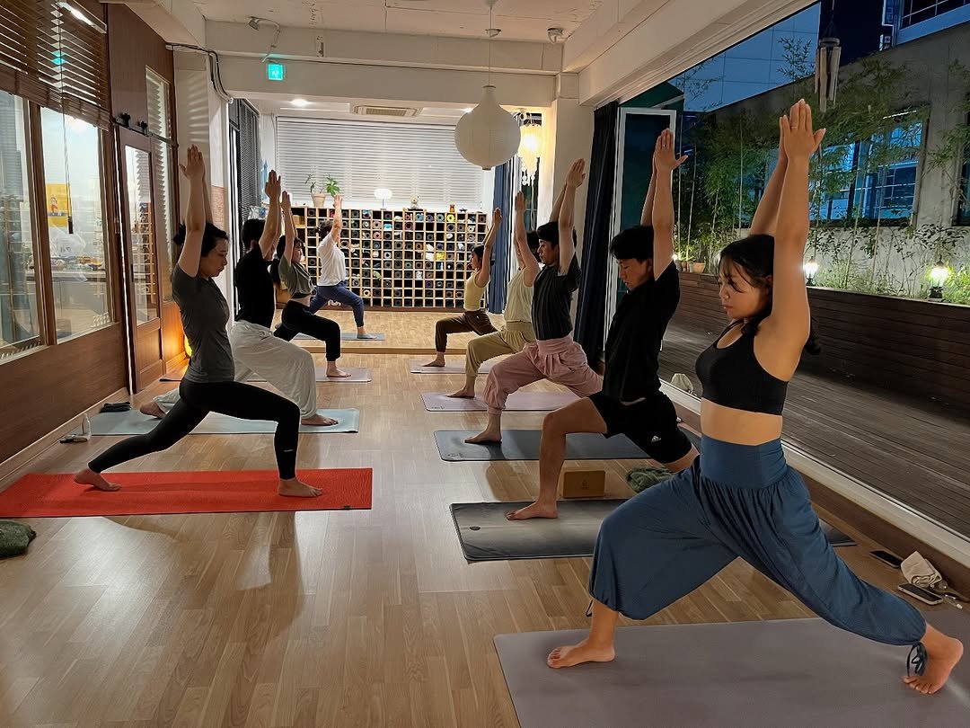 Photo by 려경 요가 on August 07, 2025. May be an image of 5 people, people practicing yoga and text.