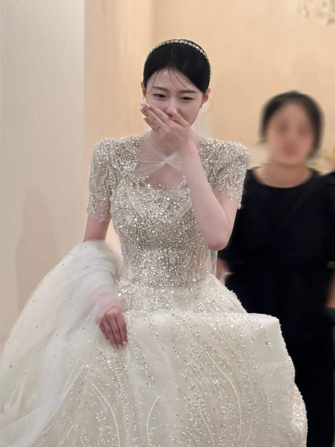 Photo by 기아한화커플⚾️ on June 28, 2025. May be an image of 1 person, dress, gown, wedding and text.