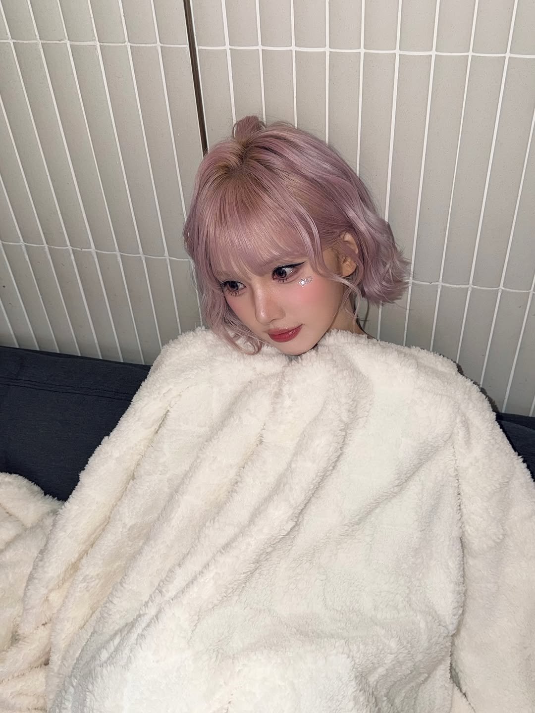 Photo by Eunha on October 18, 2025. May be an image of one or more people, hair, bath robe, robe and text.
