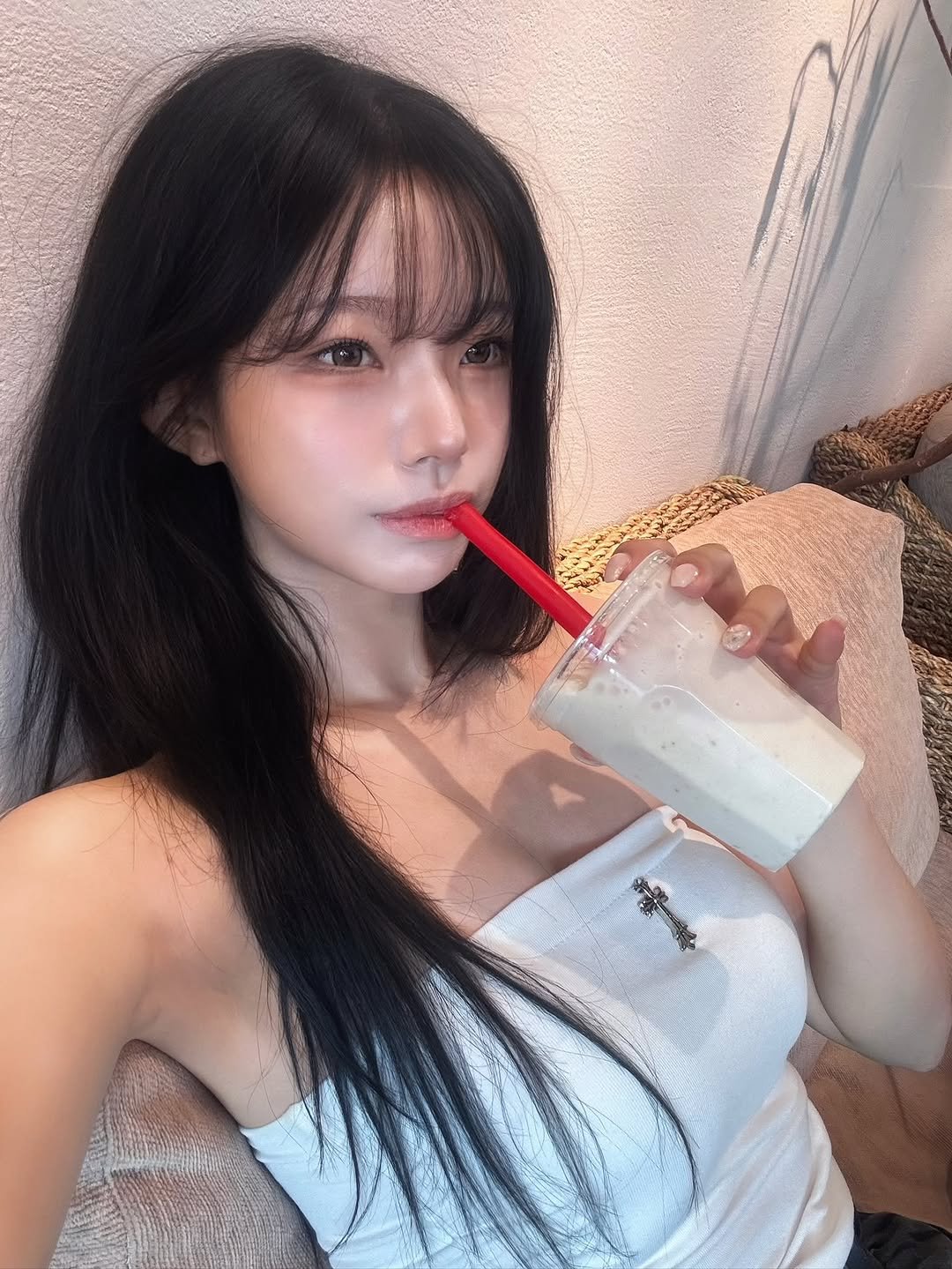 Photo by 은방울 on August 29, 2025. May be an image of 1 person, hair, drink and text.