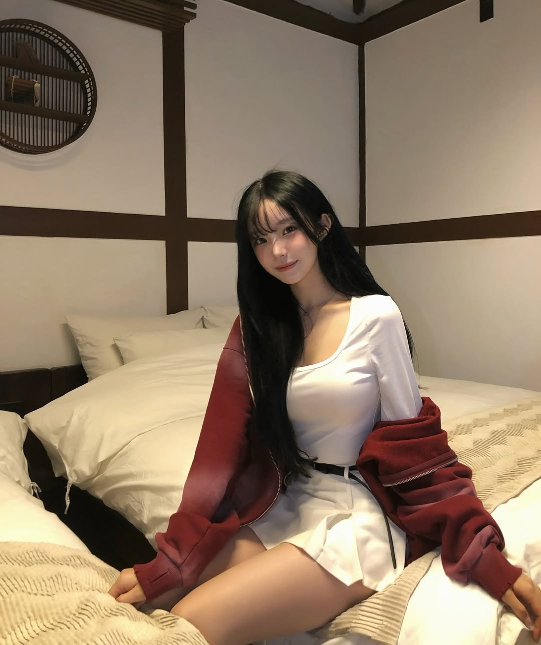 Photo by 은방울 on December 14, 2025. May be an image of one or more people, hair, sleepwear, dress, miniskirt, bed, bedroom and text.