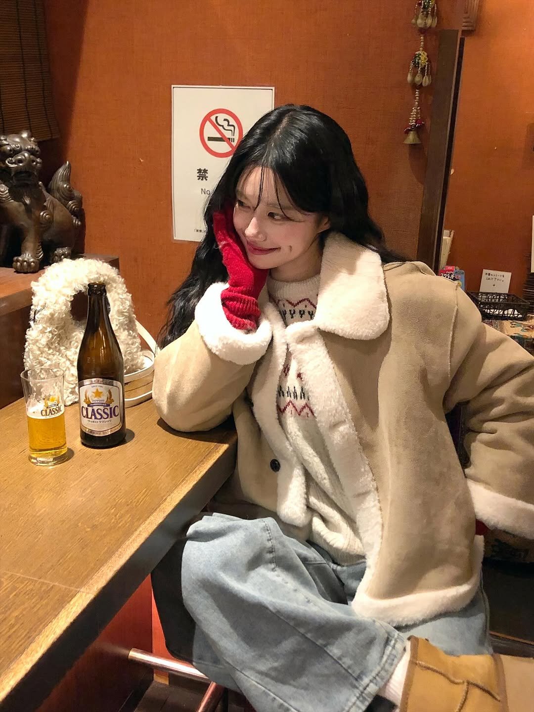 Photo shared by 노정화 on December 16, 2025 tagging @dayroze_official. May be an image of duffle coat, beer, overcoat, parka, bath robe and text.
