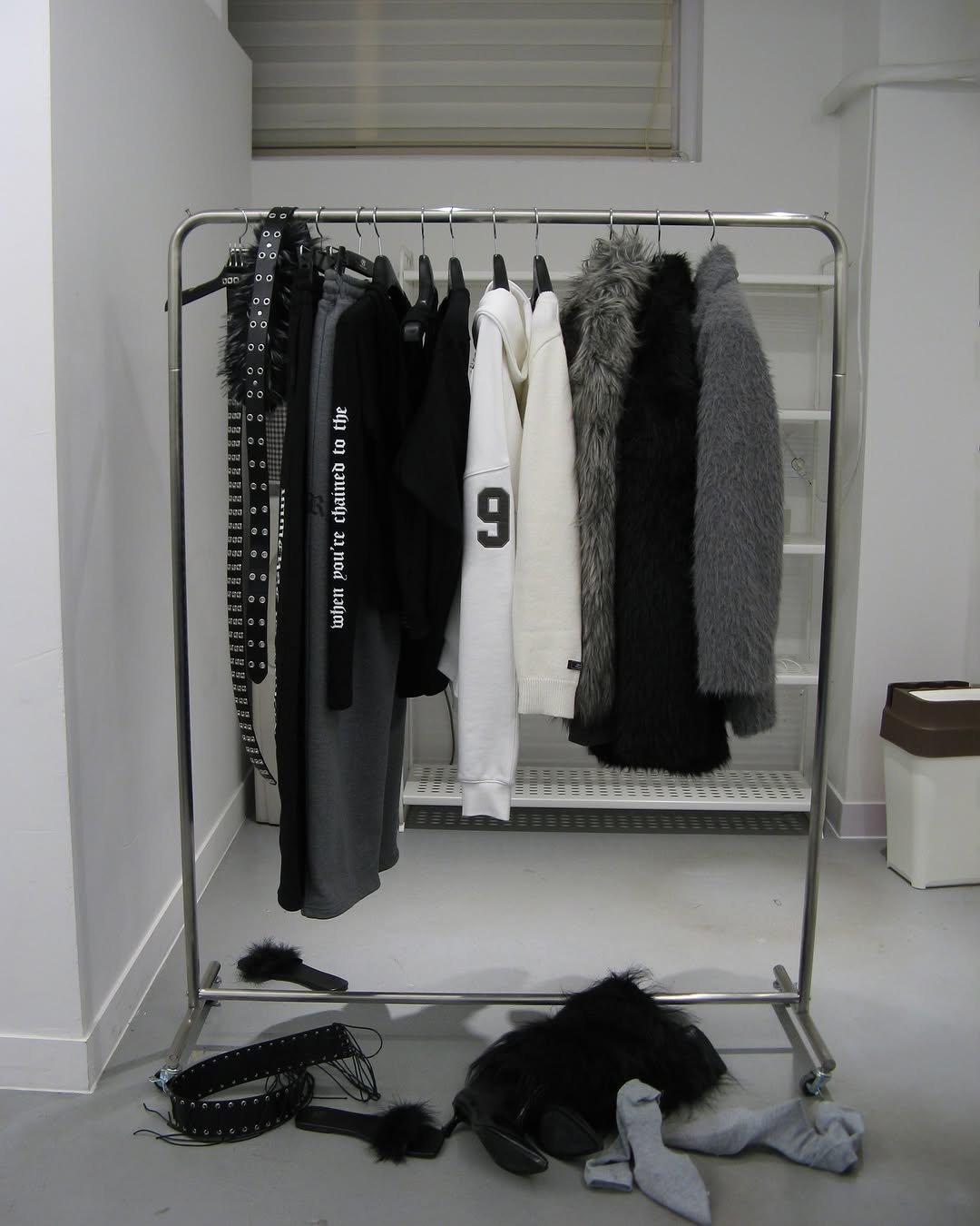 Photo by ROCKCAKE on December 03, 2025. May be an image of coat rack, clothes hanger, rack and text.