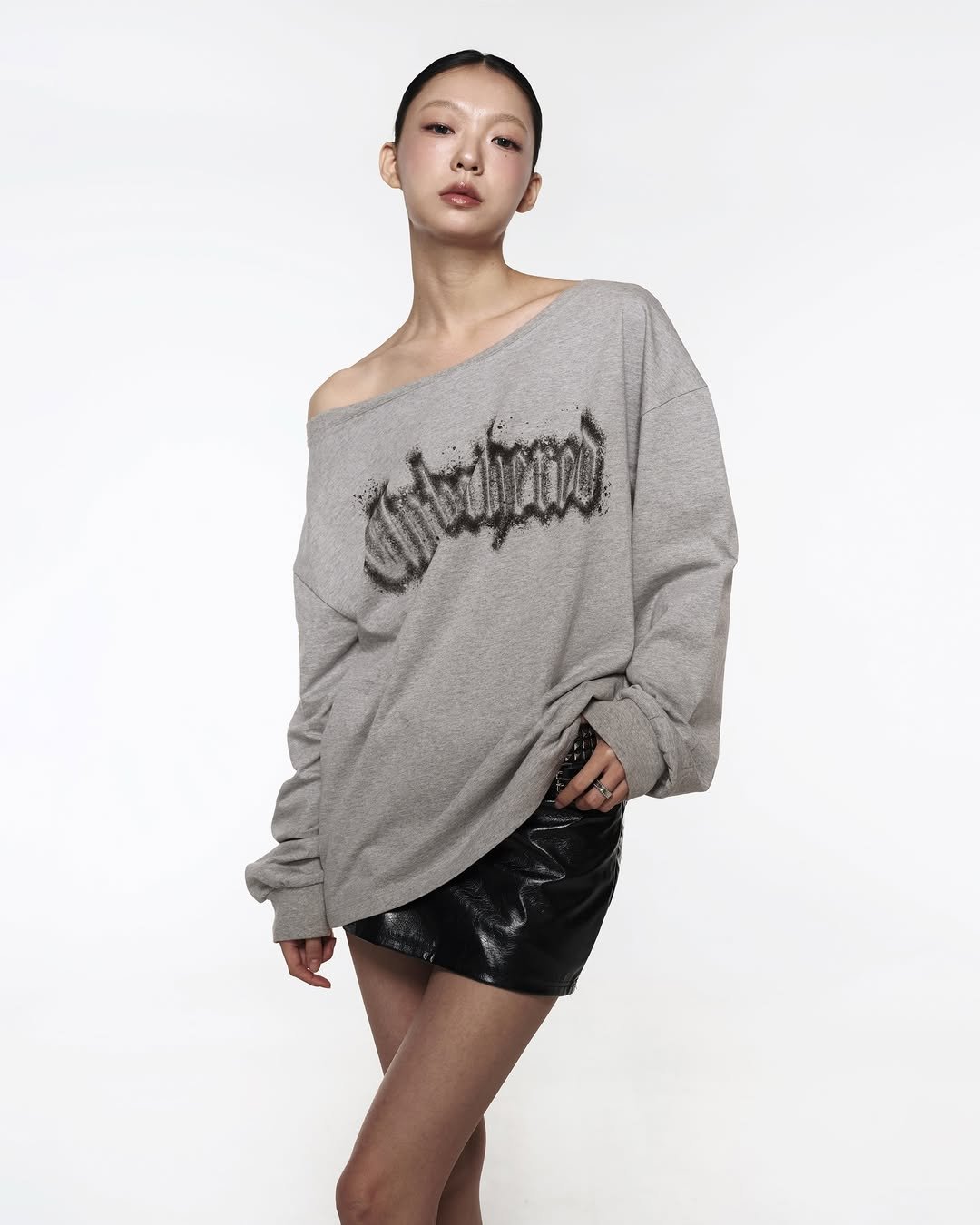 Photo by ROCKCAKE on February 07, 2026. May be an image of sweater, miniskirt, top, sweatshirt and text.