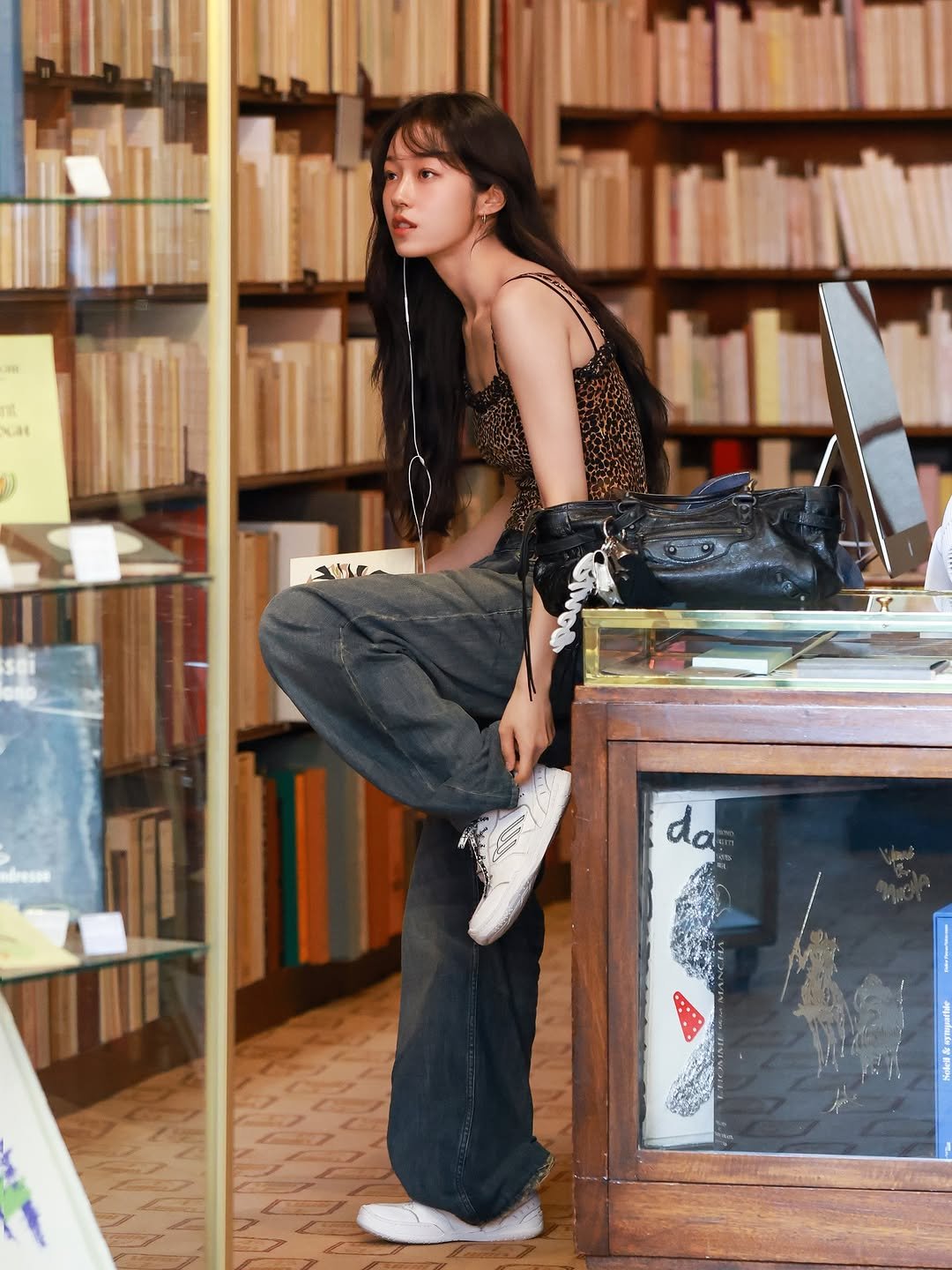 Photo shared by 노윤서 on August 06, 2025 tagging @balenciaga. May be an image of 1 person, book and text.