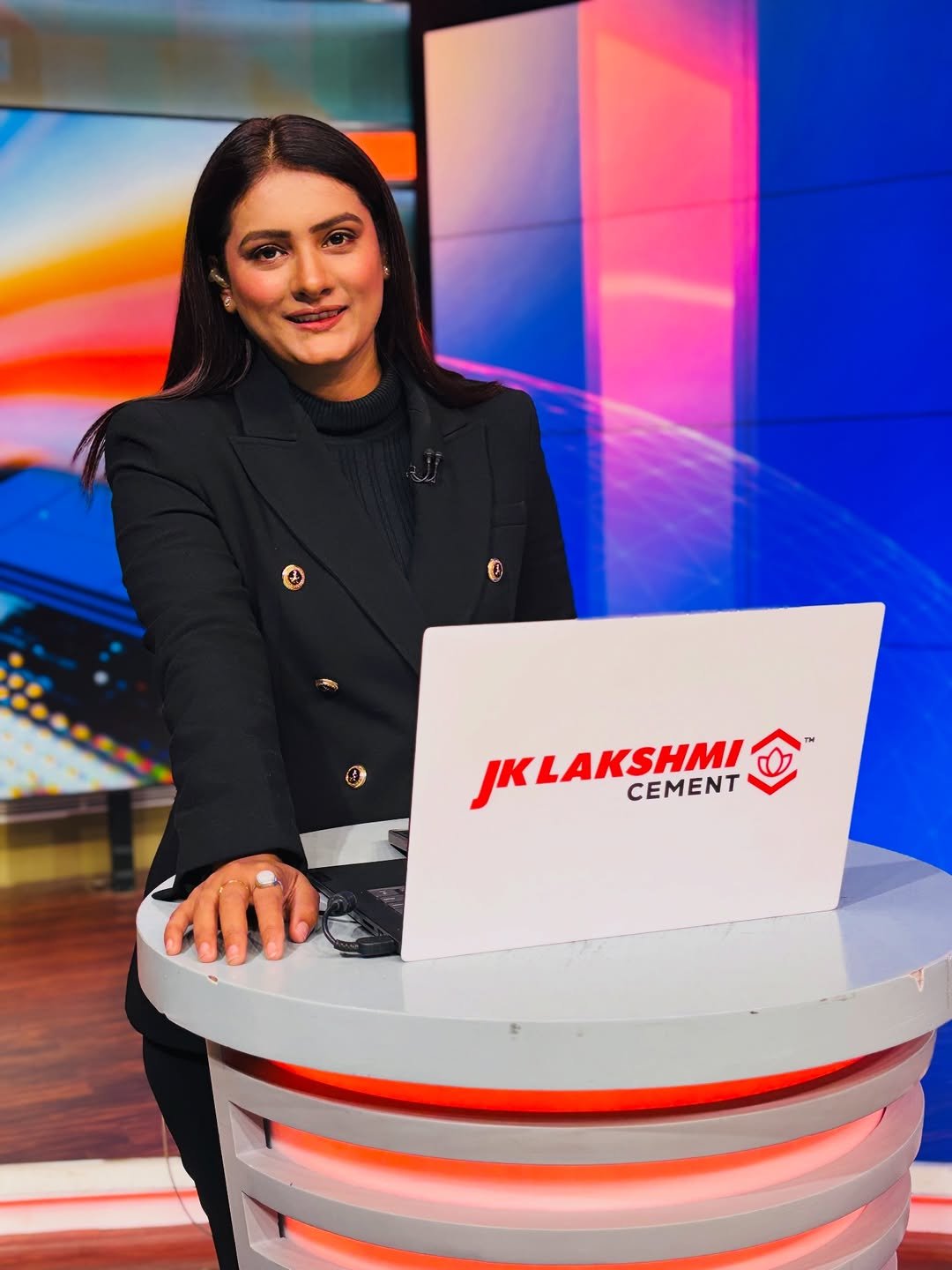 Photo by Romita Tiwari on December 26, 2025. May be an image of television, newsroom, office and text that says '0 JKLAKSHMI CEMENT'.
