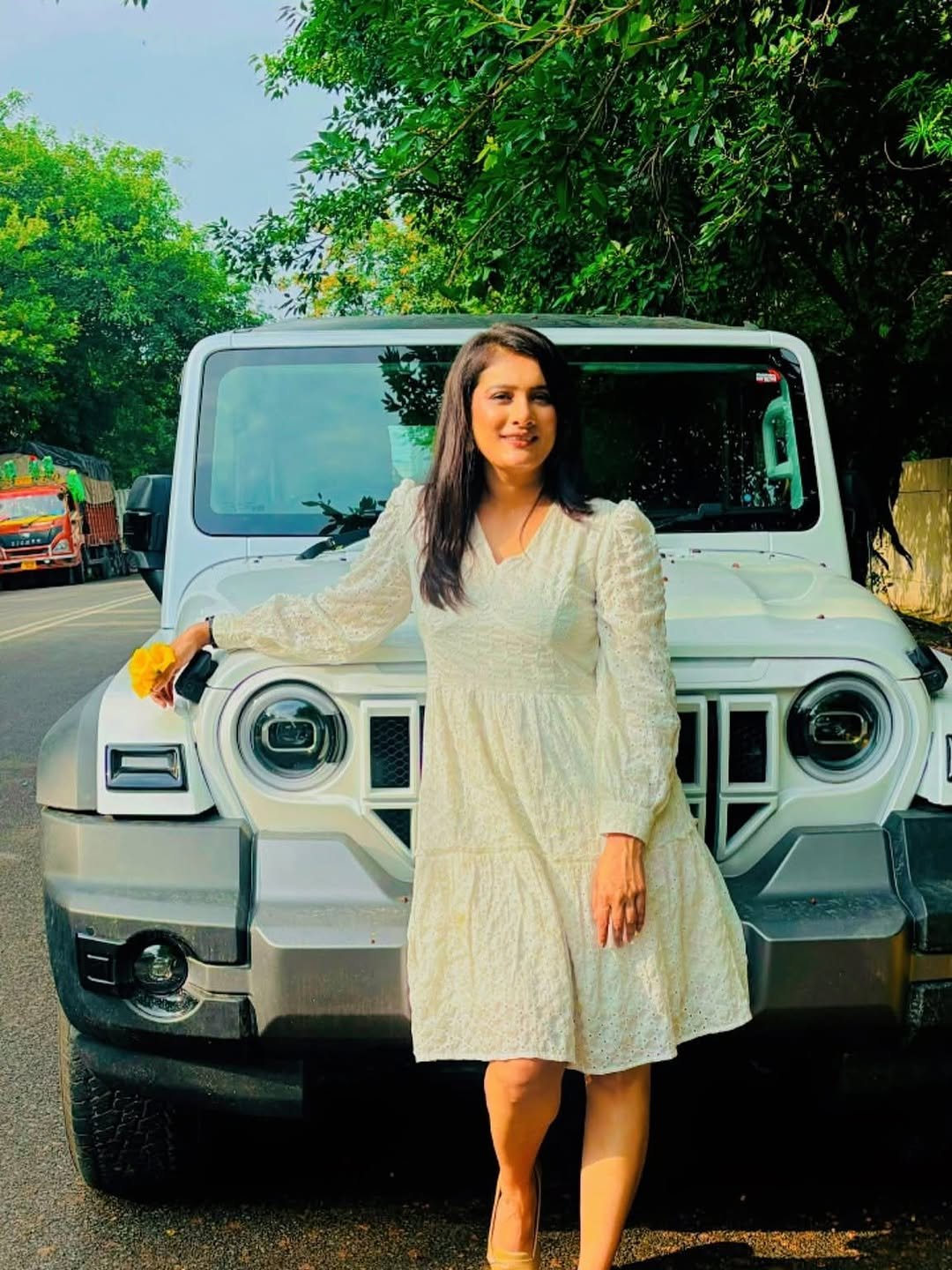 Photo by Romita Tiwari on September 22, 2025. May be an image of 1 person, jeep, limousine, dress, road and text.