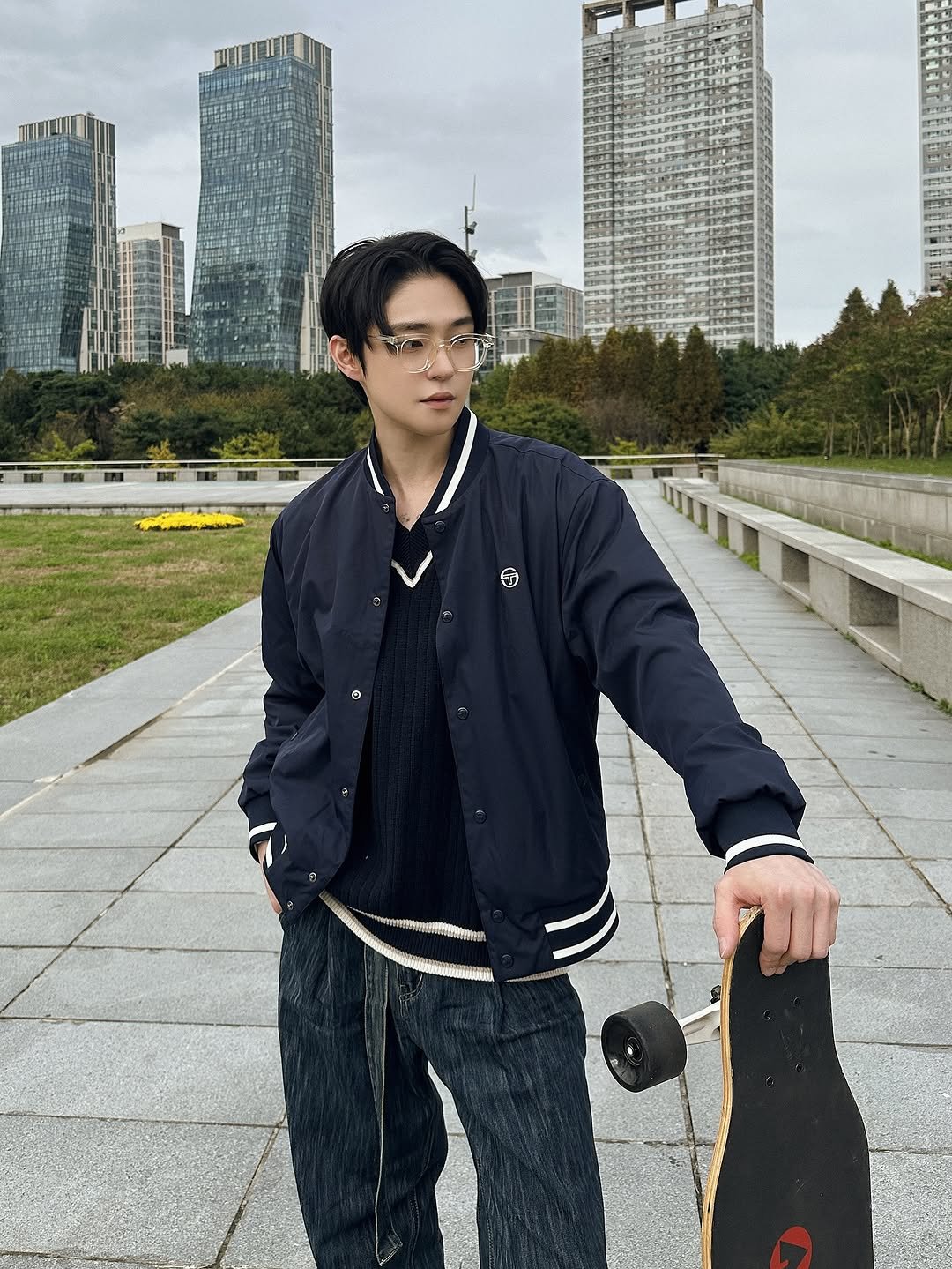 Photo by Injun You on October 15, 2025. May be an image of skateboard, duffle coat, parka, street and text.