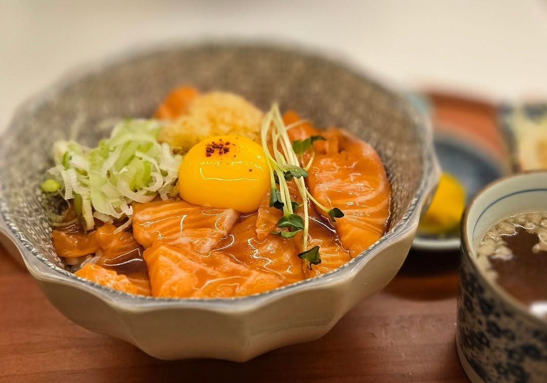 Photo by 견자희 on January 14, 2026. May be an image of sashimi, sushi, roe, poached egg, salmon and text.