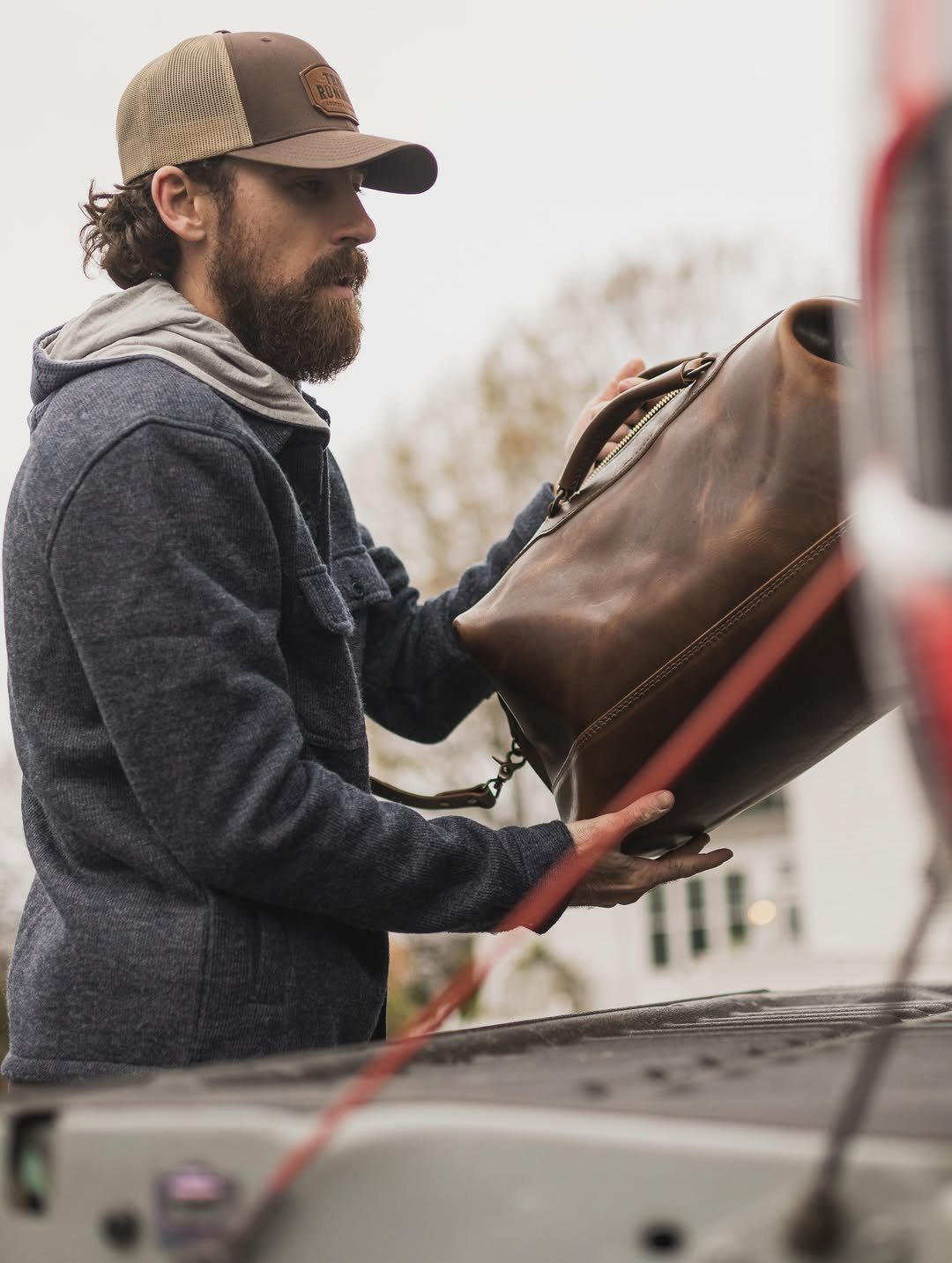 Photo shared by Ryan Blaney on December 22, 2025 tagging @rangeleather. May be an image of tool bag, saddle-stitched leather, leather, sling, pouch, briefcase, outerwear and text.