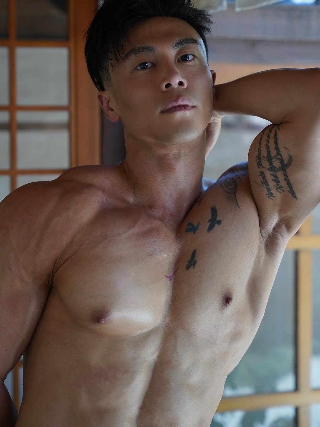 Photo by Ryan Ding on October 27, 2025. May be an image of one or more people, biceps, people bodybuilding and text.