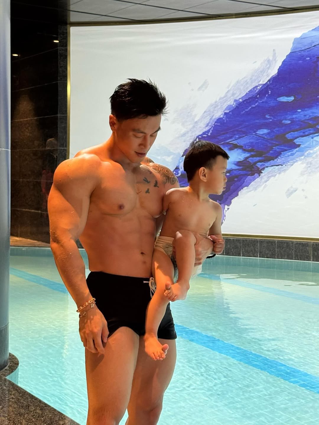 Photo by Ryan Ding on April 24, 2026. May be an image of baby, biceps, diaper, pool and text.