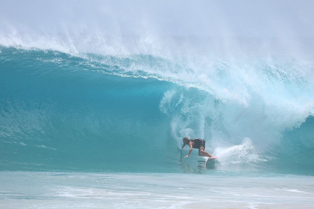 Photo shared by Alex Miranda on April 13, 2026 tagging @ryankainalo. May be an image of surfboard, wetsuit, water, ocean and text.