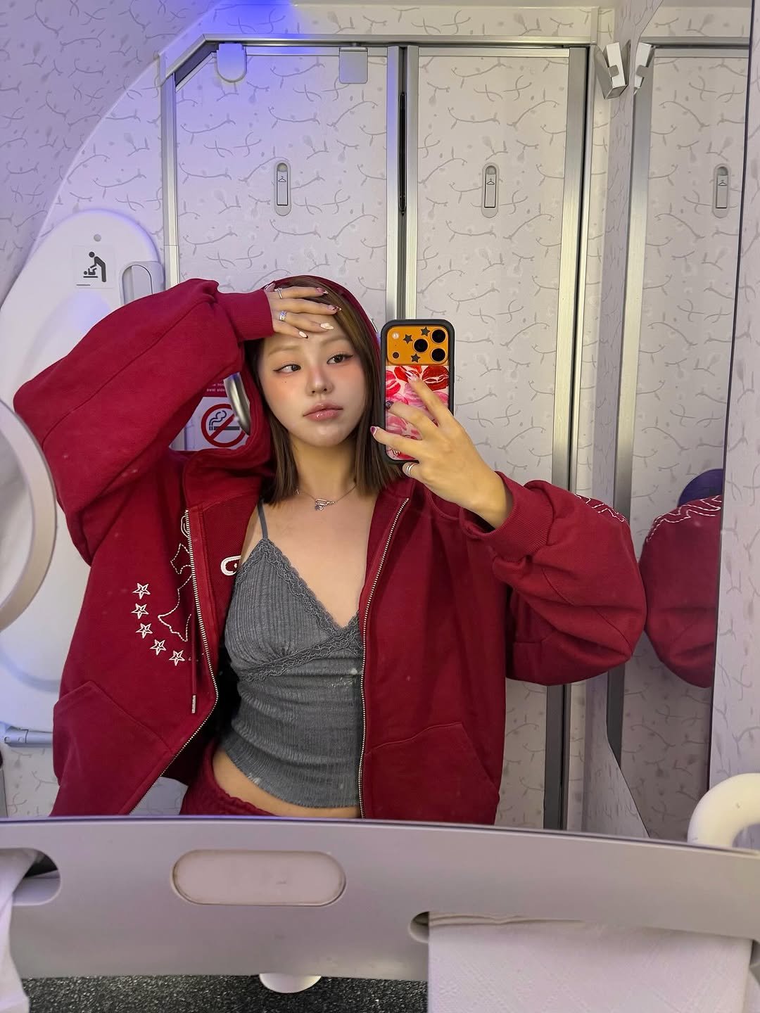 Photo shared by 령령 𝐑𝐲𝐞𝐨𝐧𝐠𝐫𝐲𝐞𝐨𝐧𝐠 ♡⁼³₌₃ on October 11, 2025 tagging @apple. May be a selfie of phone, flight jacket, mirror and text.