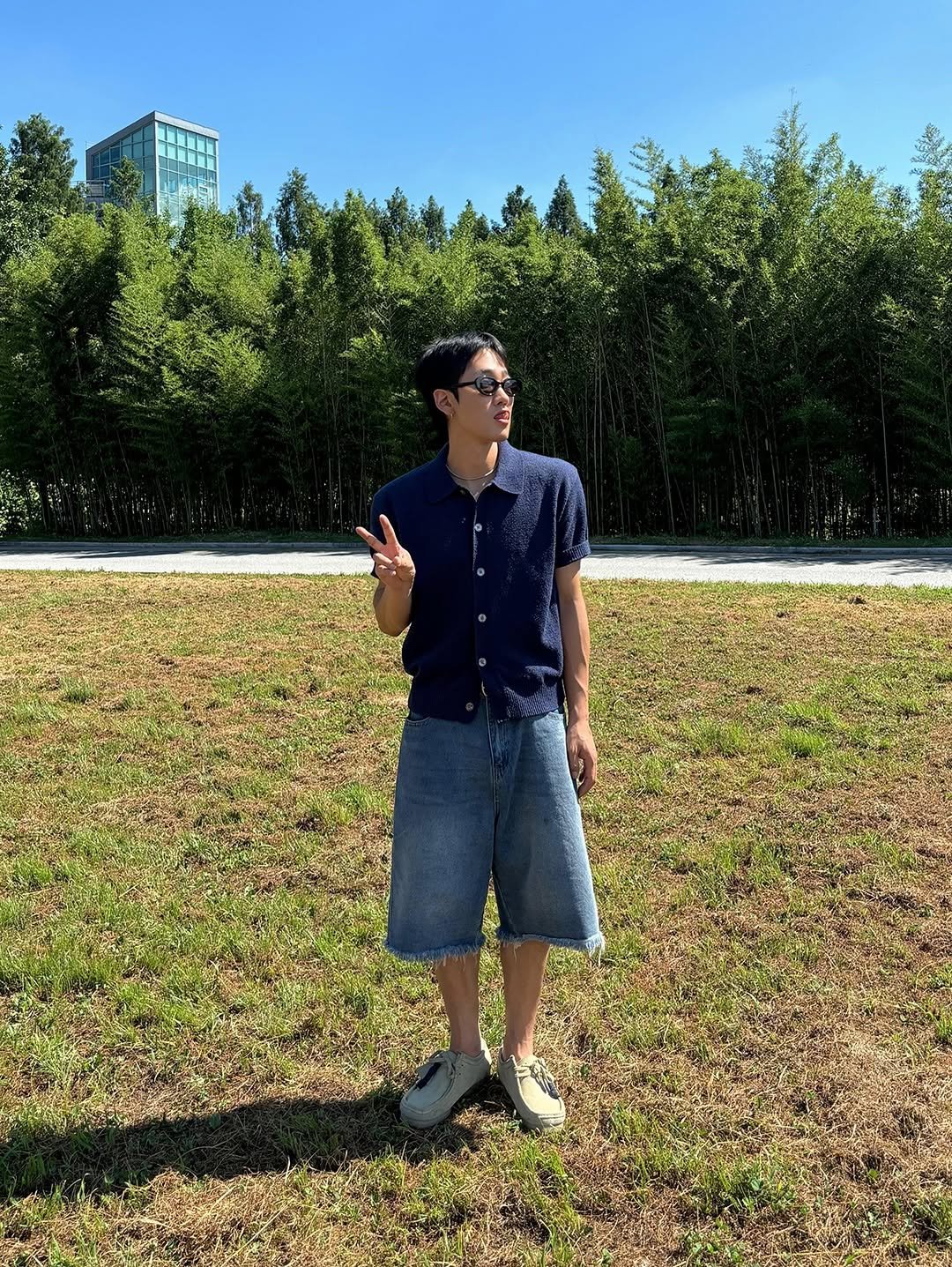 Photo by 신상준/아넌 on July 28, 2025. May be an image of 1 person, shorts, grass and text.