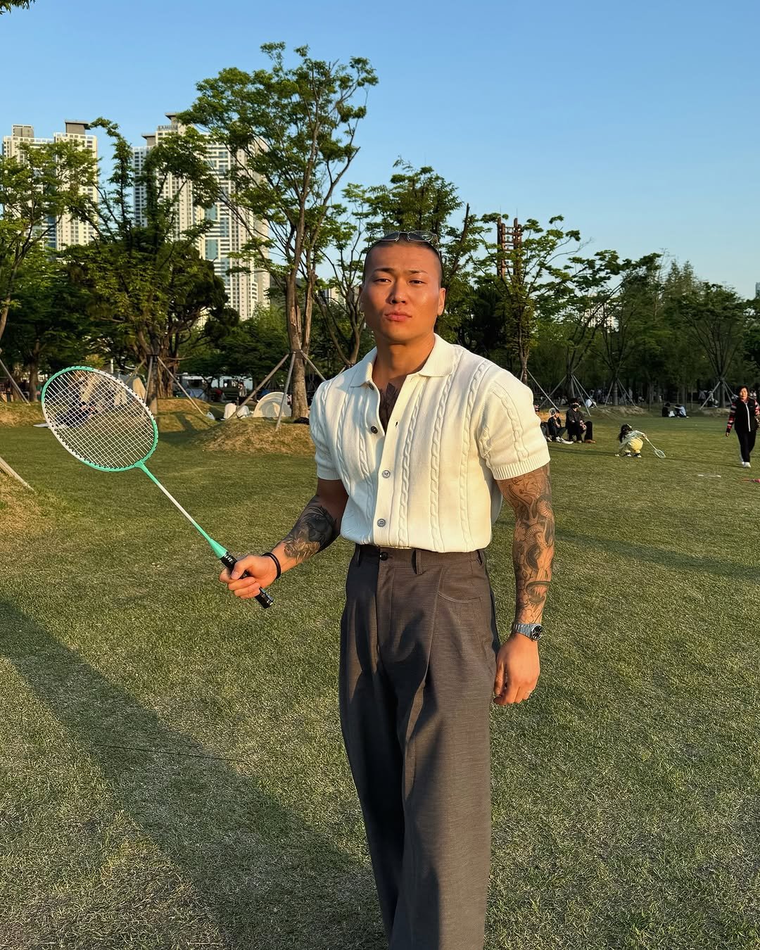 Photo shared by 돌쇠 on May 08, 2025 tagging @look.at.stone. May be an image of 4 people, people golfing, racket, sports equipment, grass, park and text.