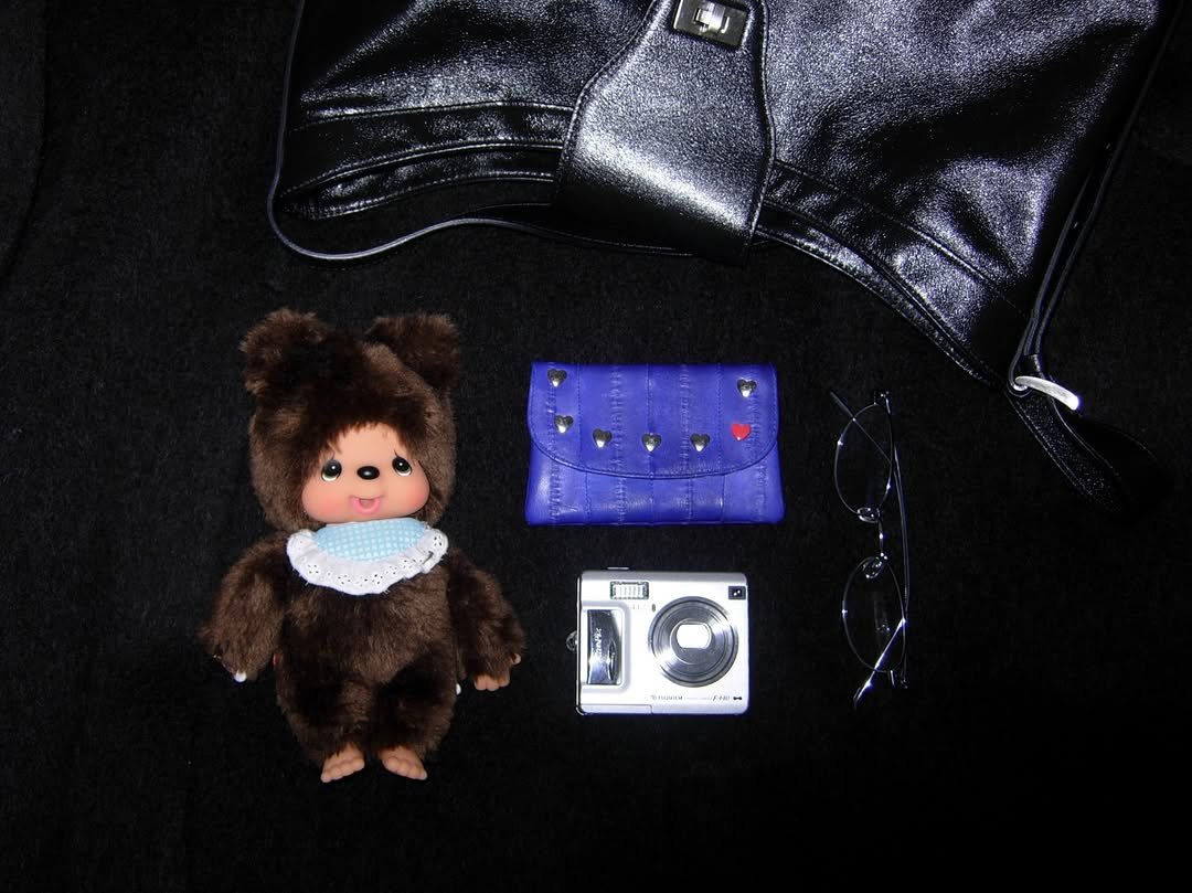 Photo shared by Subin Shin on December 29, 2025 tagging @double_quotes, and @caviar_products.jp. May be an image of purse, portable cassette player, tambourine, doll and text.
