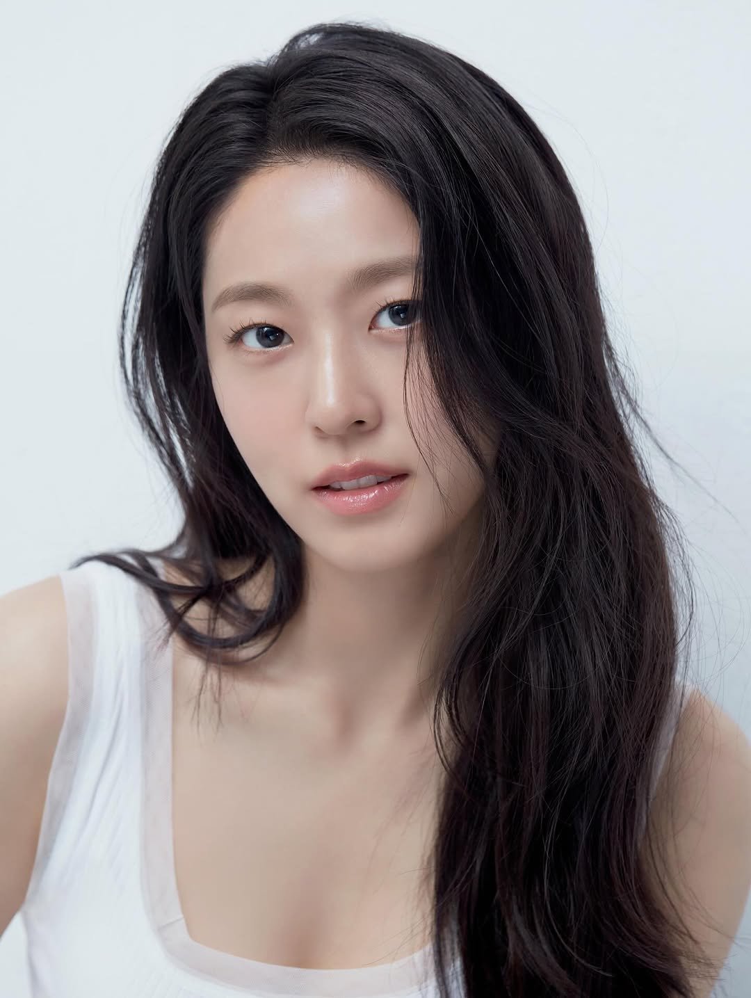 Photo shared by 김설현 on October 28, 2025 tagging @thepresentofficial. May be an image of one or more people, hair, makeup, top and text.