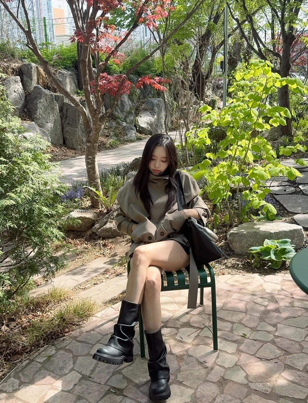 Photo by 이솔이 ✨ on April 27, 2026. May be an image of overcoat, boots, parka, miniskirt and text.