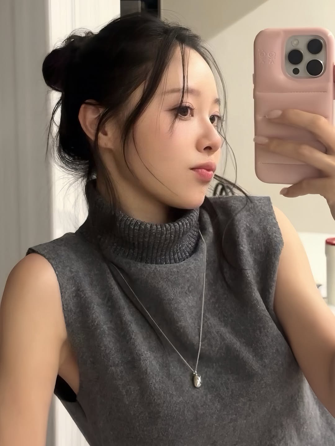 Photo by 이솔이 ✨ on February 26, 2026. May be a selfie of one or more people, hair, phone, top, turtleneck, mirror and text.