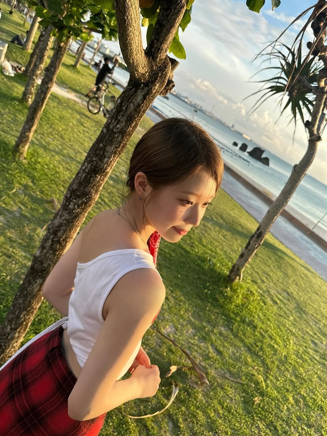 Photo by SAY MY NAME (세이마이네임) on September 21, 2025. May be an image of 1 person, skirt, sarong, beach, ocean and text.