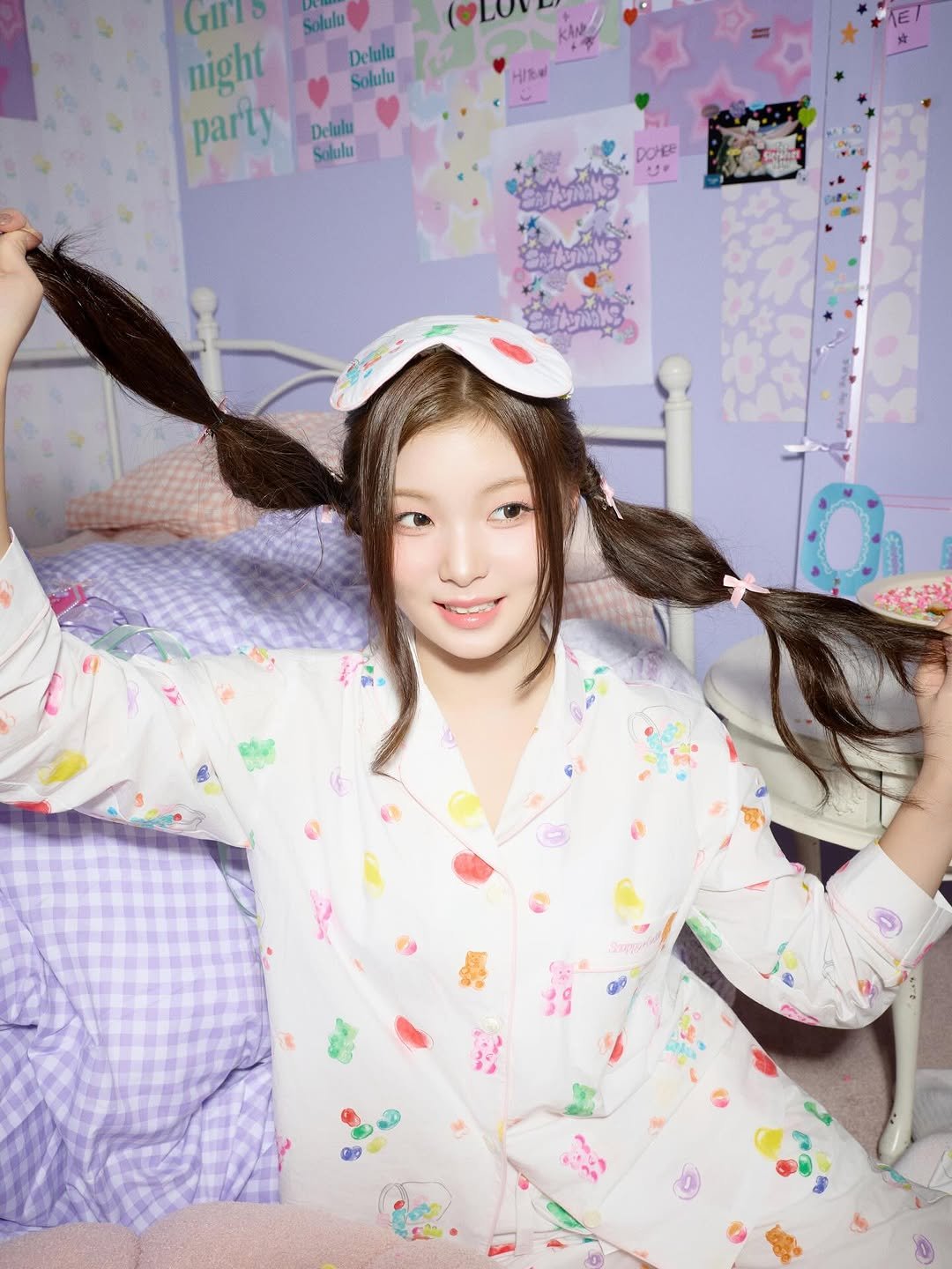 Photo by SAY MY NAME (세이마이네임) on December 20, 2025. May be an image of one or more people, braids, makeup, sleepwear, robe, bath robe and text.