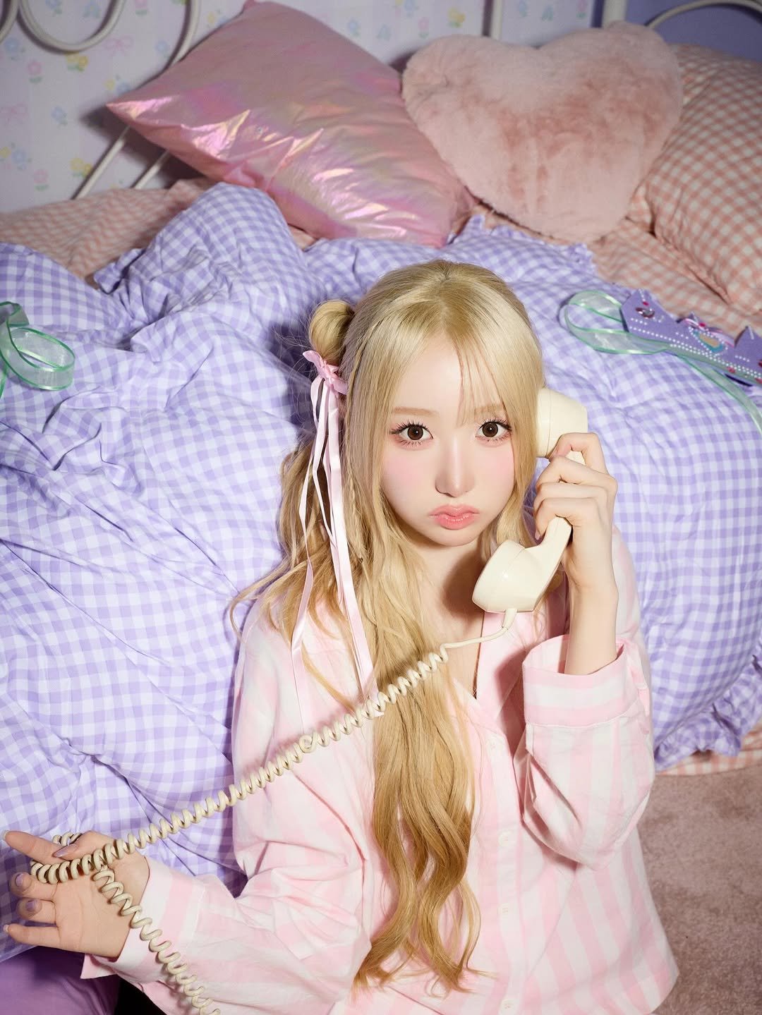 Photo by SAY MY NAME (세이마이네임) on December 20, 2025. May be an image of one or more people, makeup, phone, sleepwear, telephone and text.