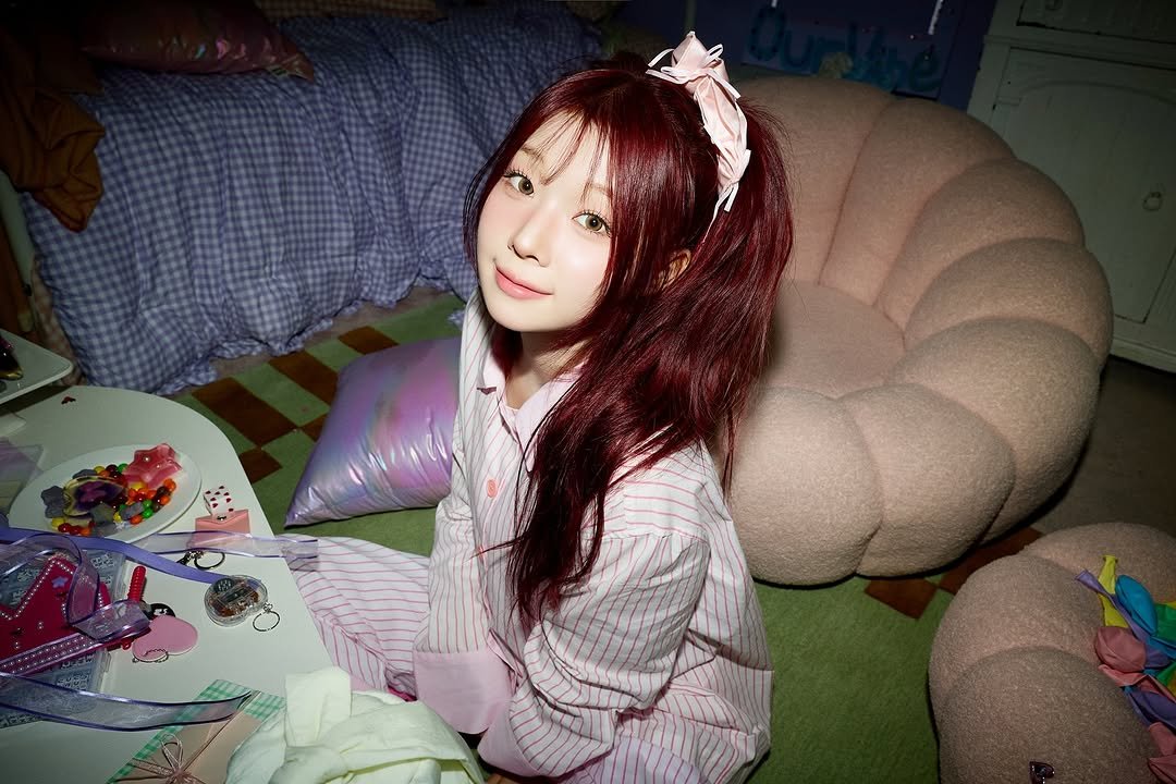 Photo by SAY MY NAME (세이마이네임) on December 19, 2025. May be an image of one or more people, braids, sleepwear, bath robe and text.