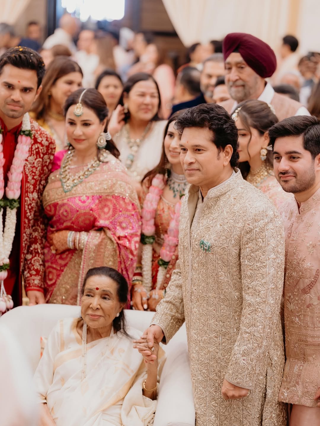 Photo by Sachin Tendulkar on April 13, 2026. May be an image of one or more people, henna, wedding and text.
