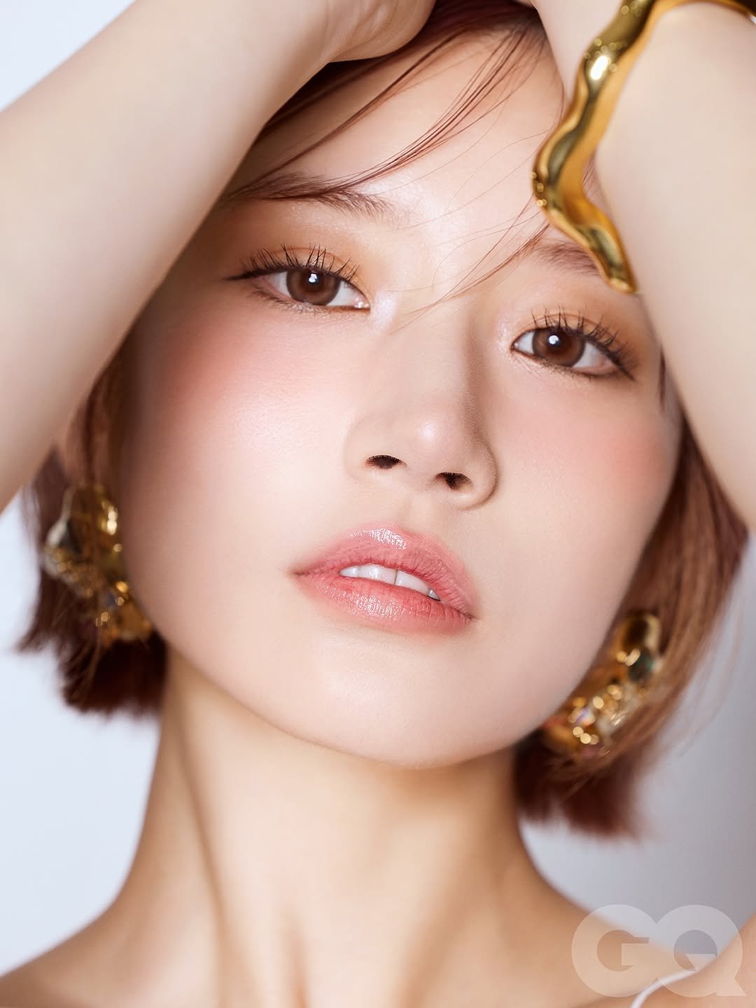 Photo shared by GQ Thailand on October 05, 2025 tagging @mqmeow, @chatostudio, @stylekoonn, and @saika_kawakita__official. May be a closeup of 1 person, hair, makeup and text.