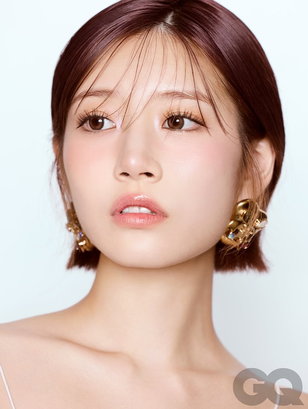 Photo shared by GQ Thailand on October 05, 2025 tagging @mqmeow, @chatostudio, @stylekoonn, and @saika_kawakita__official. May be a closeup of 1 person, braids, makeup and text.