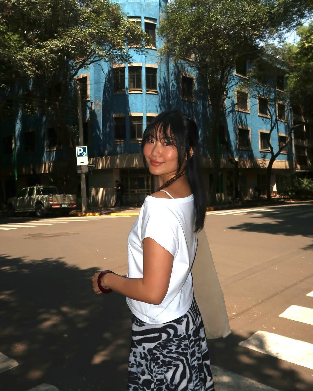 Photo by Samantha Wong on April 02, 2026. May be an image of one or more people, hair, miniskirt, street and text.