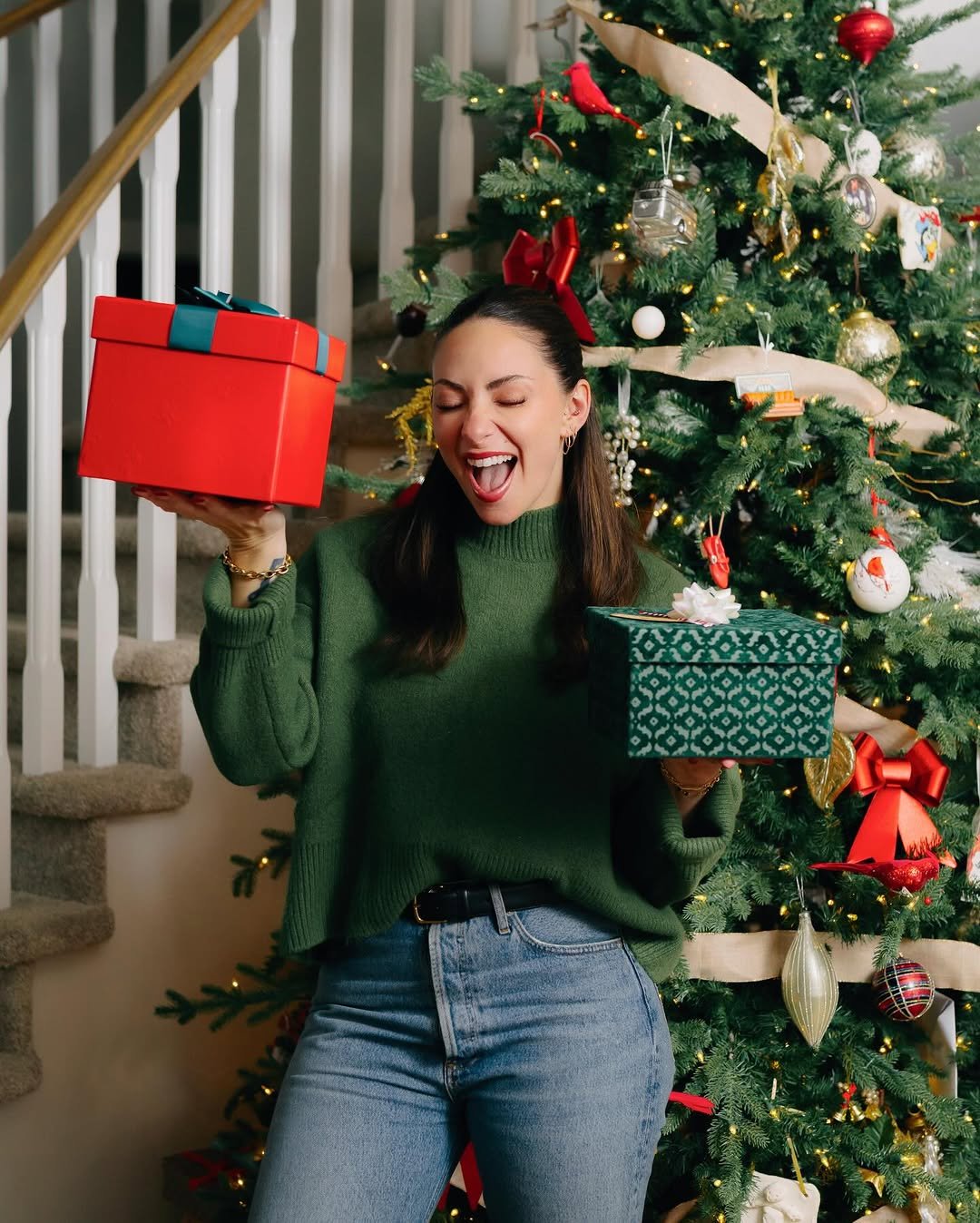 Photo by Samantha Montgomery on December 01, 2025. May be an image of christmas tree, sweater, tinsel and text.