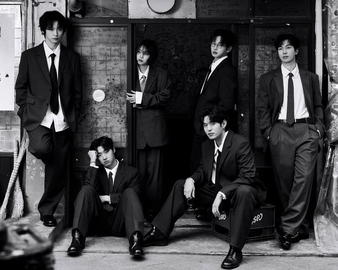 Photo by 김민석 on February 02, 2026. May be a black-and-white image of one or more people, bangs, bolo tie, suit, cigarette and text.