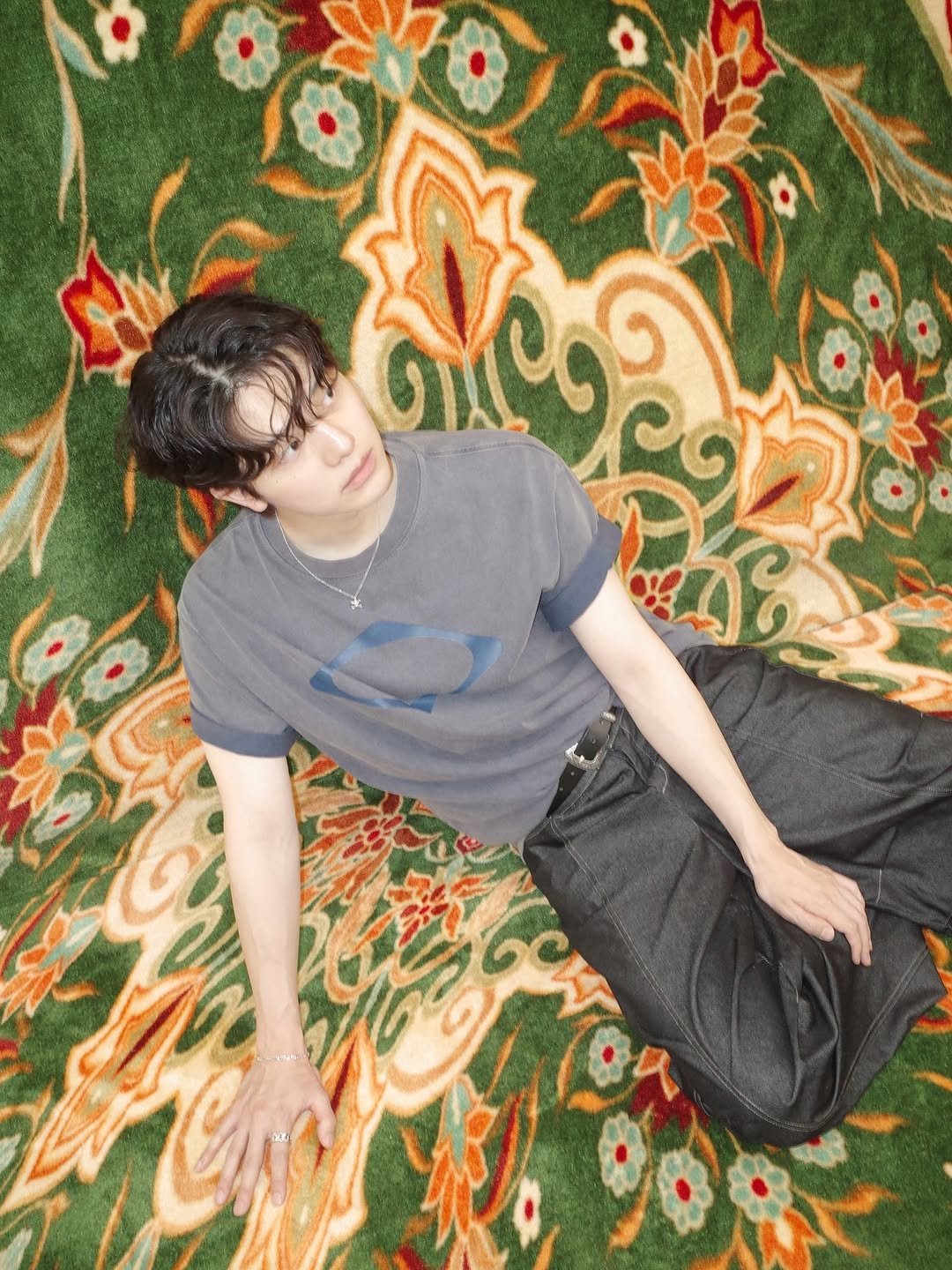 Photo shared by 사선웅 on June 16, 2025 tagging @say_touche. May be an image of 1 person, carpet, bolo tie and text.